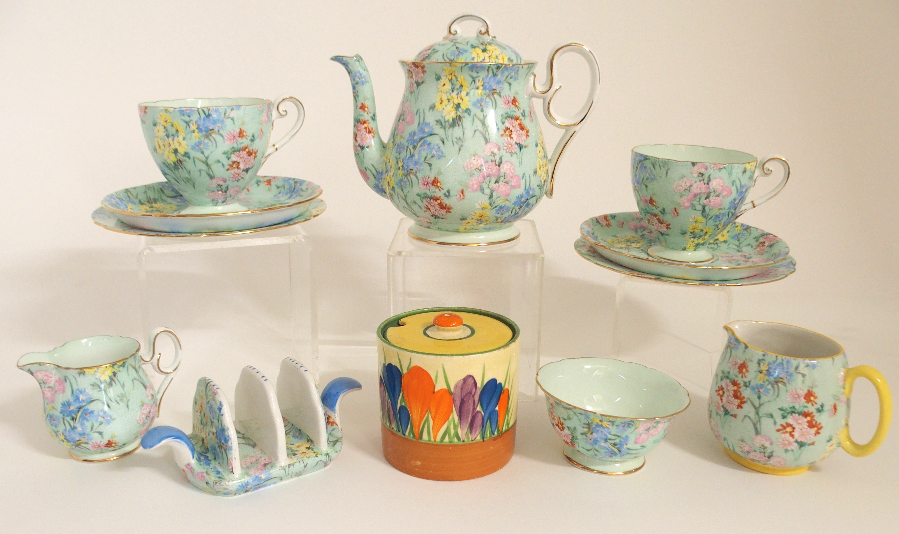 A SHELLEY MELODY BREAKFAST SET comprising two trios, teapot, milk jug, sugar bowl and toastrack,