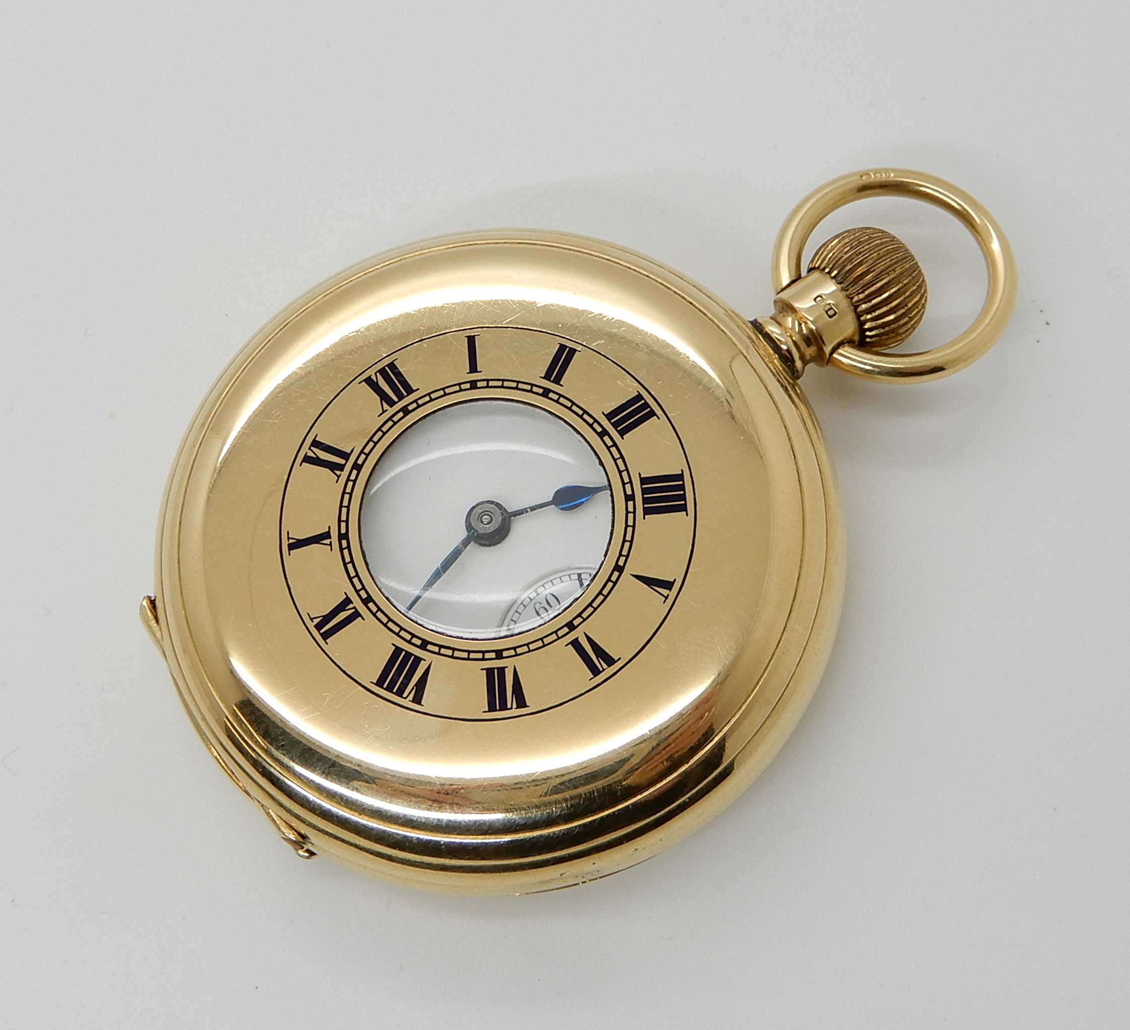 AN 18CT GOLD WALTHAM HALF HUNTER POCKET WATCH with white enamel dial, black Roman numerals,