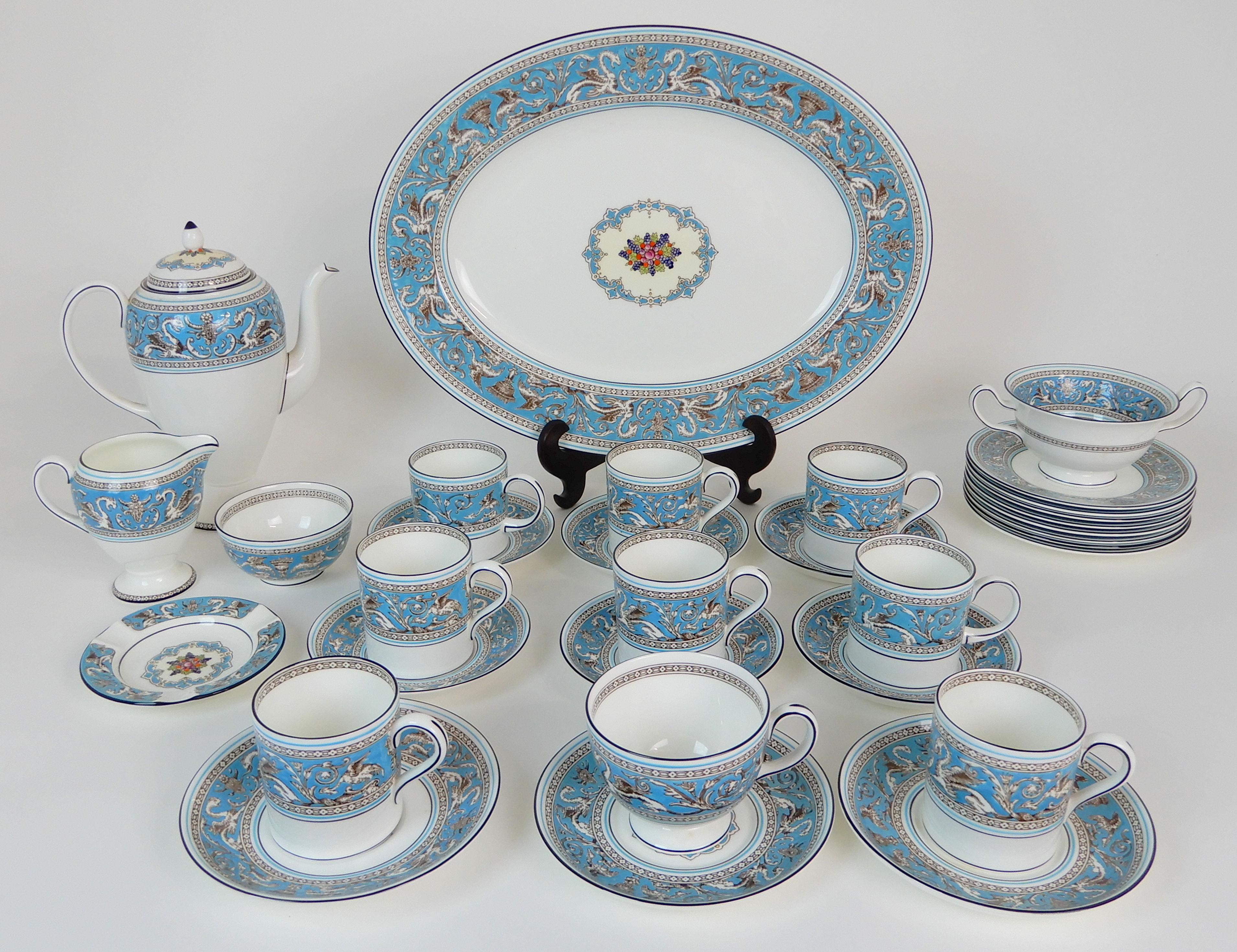 A WEDGWOOD TURQUOISE FLORENTINE COFFEE SET comprising eight cups, six saucers, six plates, milk