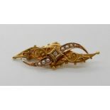 A 15ct gold pearl and diamond brooch, length 4.5cm, weight 2.6gms Condition Report: Available upon