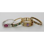 A 9ct white gold ruby and diamond accent ring size N, a 9ct aquamarine, garnet and amethyst set band