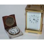 A brass carriage clock and a silver cased travel clock (2) Condition Report: Available upon request
