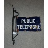 An enamel double-sided public telephone sign with bracket, sign 30 x 45cm Condition Report: