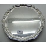 A silver salver by R & W Sorley, Sheffield 1933, of circular form with stepped scalloped rim on