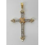 An 18ct yellow, white and rose gold diamond set cross, set with estimated approx 0.50cts of