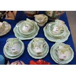 A Paladin China teaset with fluted cups comprising two cake plates, eleven side plates, eleven