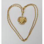 An 18ct gold 'lovers' pendant set with clear gems, length including bail 2.8cm, with a fancy 18ck