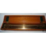 A cased brass rolling rule by U.W.W. Birmingham, 47cm wide and a brass handle dividers (2) Condition