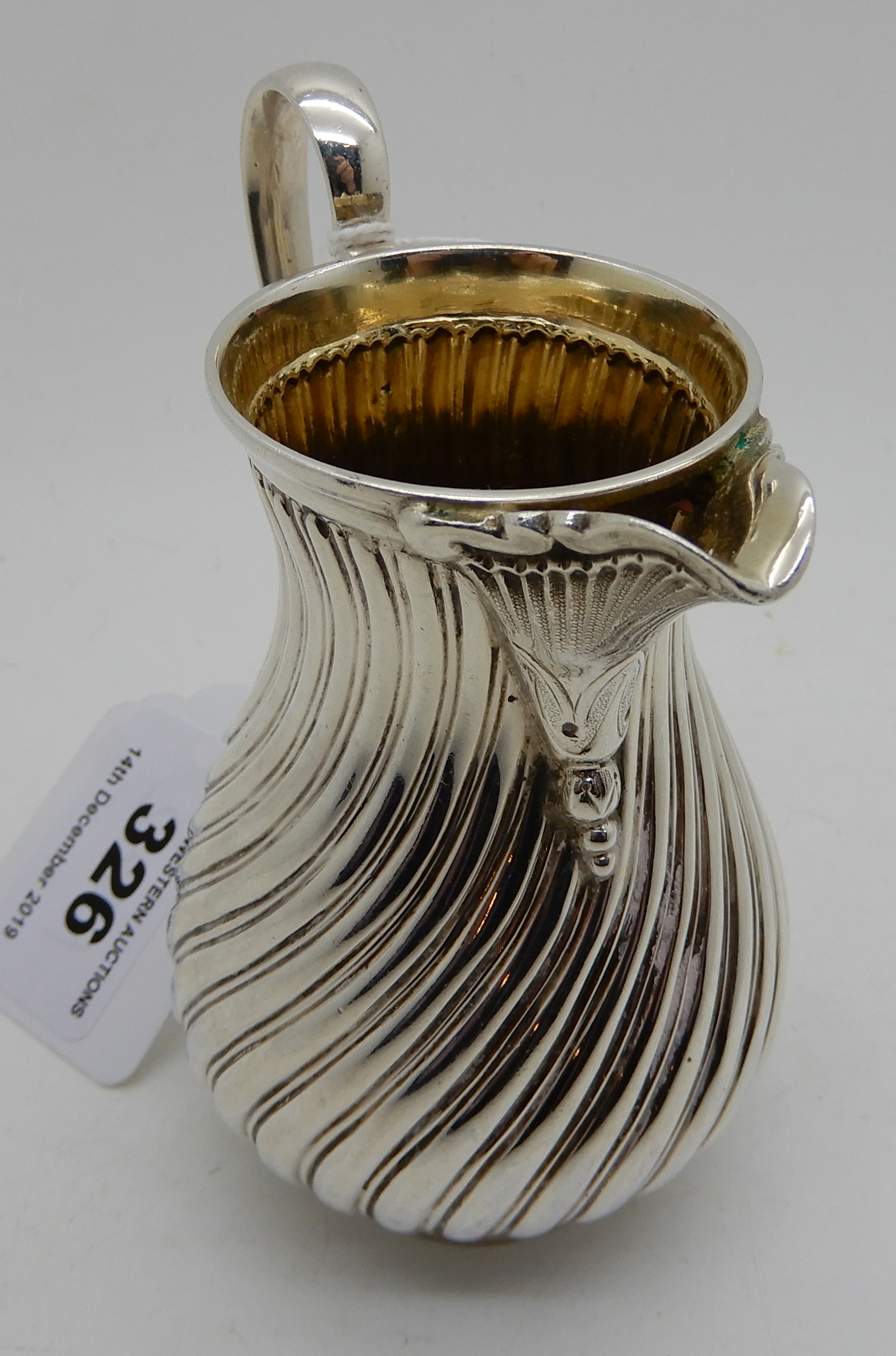 A silver cream jug by James Dixon & Sons, Sheffield 1887, of baluster shape with spiral fluting, 9cm - Image 3 of 4