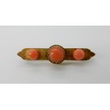 A 15ct gold coral set brooch, length 5cm, weight 5.4gms Condition Report: Available upon request