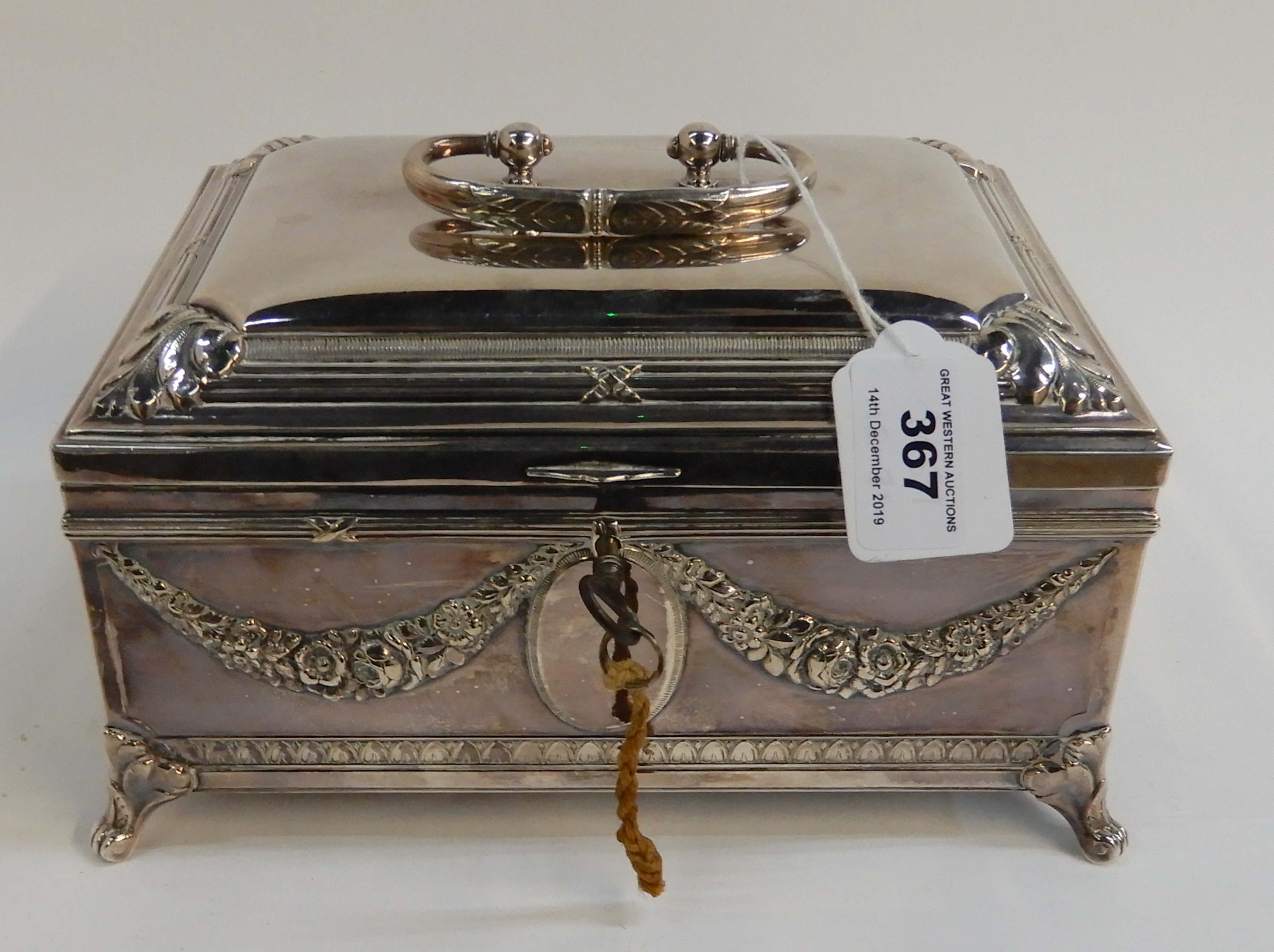 A silver plated casket decorated with floral swag decoration and fitted interior, 22cm x 16cm x 12cm