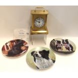 A musical clock and two collectors plates Condition Report: Available upon request