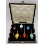 A cased set of six silver, gilt and enamel coffee spoons, Birmingham 1949 Condition Report: