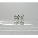 A pair of 14k white gold diamond stud earrings set with estimated approx 0.58cts of brilliant cut