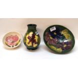 Three pieces of Moorcroft including a clematis bowl, 18m diameter, a hibiscus vase and a magnolia