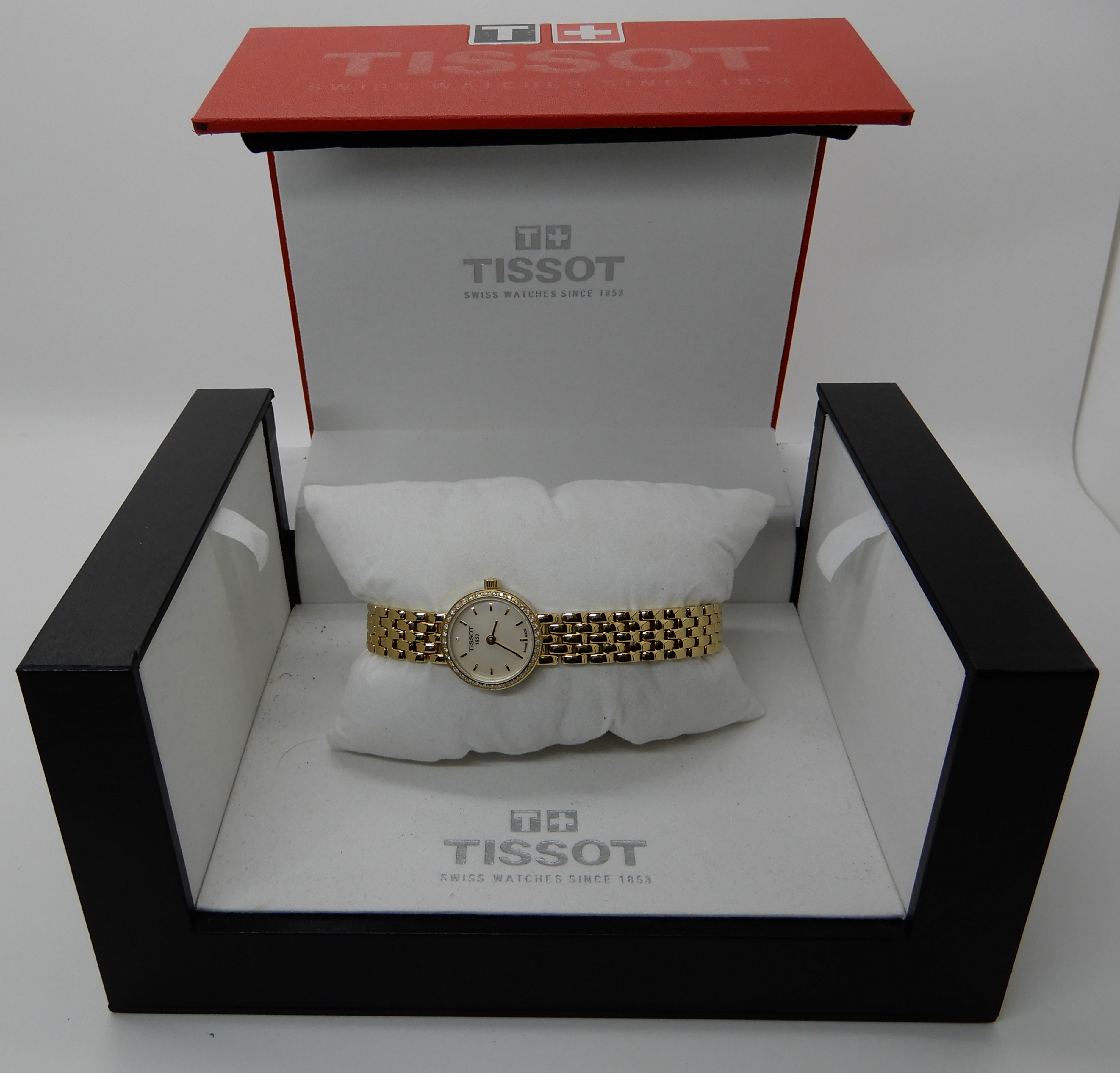 A ladies Gold plated Tissot wristwatch with diamond bezel Condition Report: Available upon request