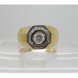 A yellow metal gents ring set with clear gems, size S1/2 weight 6.7gms Condition Report: Available