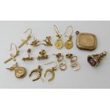 A collection of gold and yellow metal earrings to include owl and swallow shaped examples, a