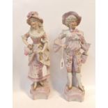 A pair of pink bisque figures of a man and woman Condition Report: man has firing crack to the bow