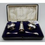 A cased three piece silver condiment set, Birmingham 1923 Condition Report: Available upon request