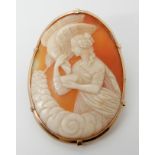 A yellow metal mounted well carved shell cameo brooch depicting Hebe and the eagle, dimensions 5.3cm