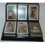 An album of vintage postcards and loose examples, The Scottish Chiefs Illustrated and an autograph