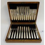 A cased twenty four piece EP and mother of pearl dessert cutlery set Condition Report: Available