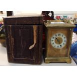 A brass cased carriage clock with travelling case Condition Report: Available upon request