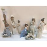 A collection of Nao figures including a Bride and Bridesmaids, a girl and puppy lampshade and five