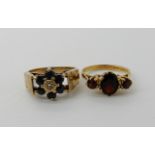 A 9ct gold retro sapphire and diamond flower cluster, size N1/2, a 9ct three garnet ring size N,