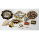 A collection of yellow metal items to include hair mourning brooches, garnet set Victorian items,