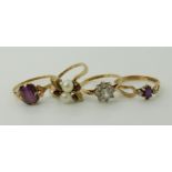 A 9ct gold garnet and pearl cluster ring size N, a 9ct gold clear gem set flower ring size O1/2