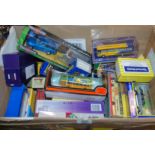 A large box of various Corgi and other model buses, cars etc in original boxes Condition Report: