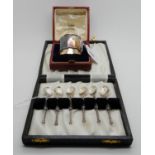 A lot comprising a cased set of six silver coffee spoons, Birmingham 1958, with heart shaped bowls