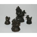 Four various Burmese opium weights, 5cm high and smaller (4) Condition Report: Available upon