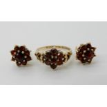 A 9ct gold garnet cluster ring, size N1/2, with matching earrings Condition Report: Available upon