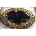 A Glasgow School style brass framed wall mirror Condition Report: Available upon request