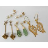 A pair of Arabic style earrings stamped 14, weight 1.9gms, a pair of 14k gold mounted Chinese