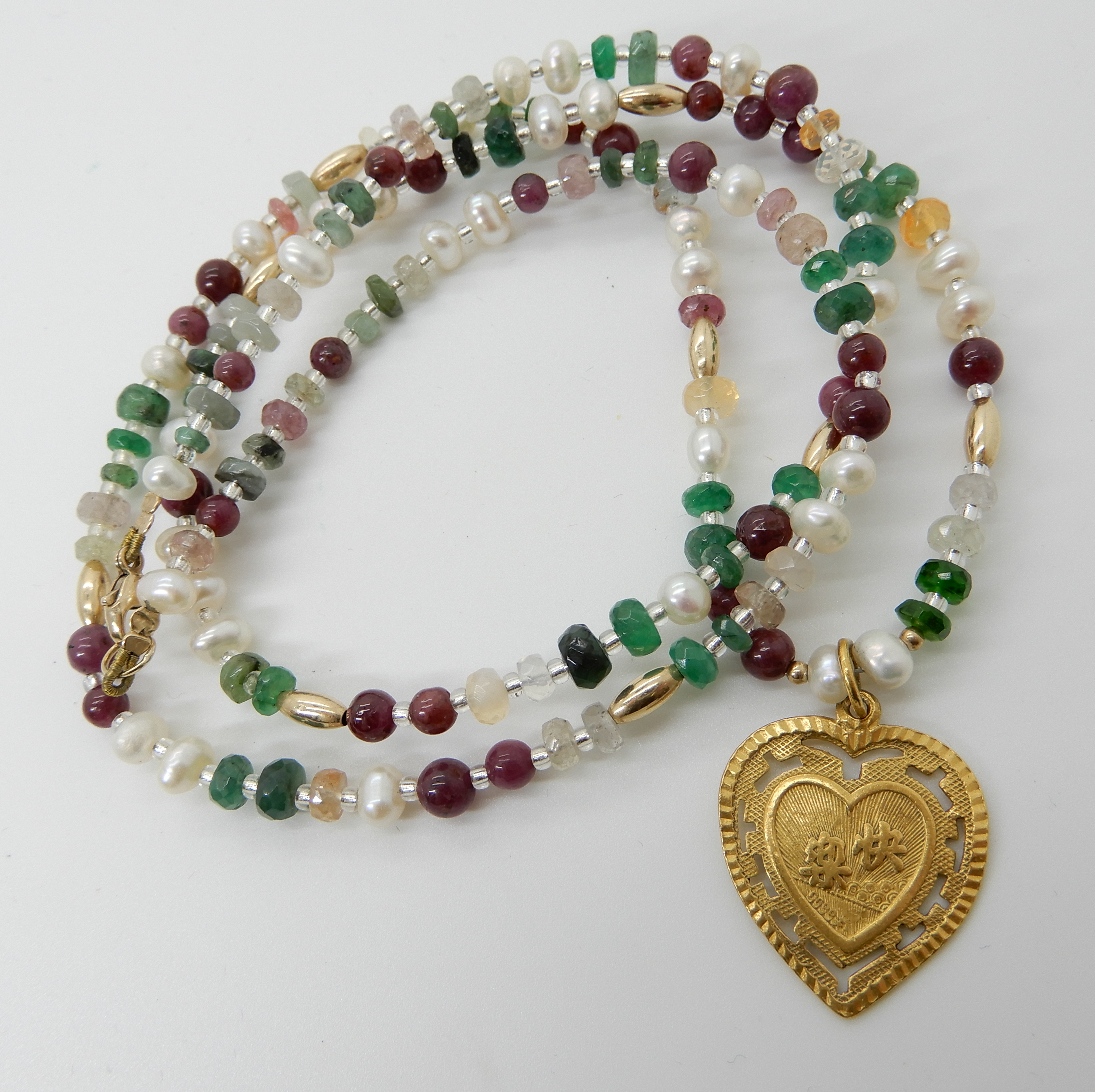 A 24k gold Chinese gold heart shaped pendant on a string of pearl emerald, ruby and other gemstone - Image 2 of 3