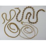 A partial 15ct fancy chain weight 6.5gms, a 14k gold chain length 38cm, weight 1gm and a bright