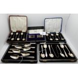 A lot comprising four assorted cased sets of silver tea and coffee spoons and a cased pair of silver