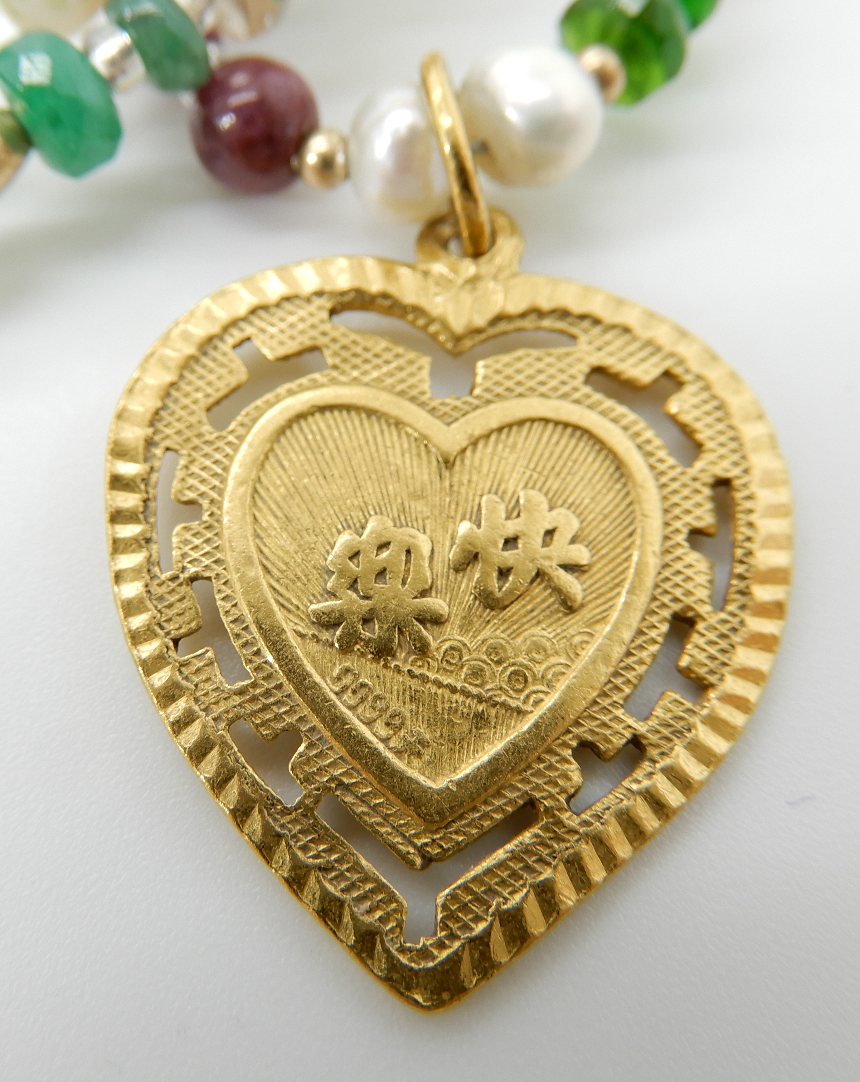 A 24k gold Chinese gold heart shaped pendant on a string of pearl emerald, ruby and other gemstone - Image 3 of 3