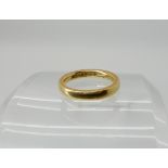 An 18ct gold wedding band hallmarked Birmingham 1926, size J, weight 4.1gms Condition Report: