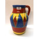A Clarice Cliff Bizarre lotus shape jug with geometric design (af) Condition Report: Available