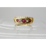 An 18ct gold red gem and diamond ring size L1/2, weight 3.2gms Condition Report: Available upon