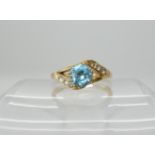 An 18ct gold blue zircon and diamond ring size Q, weight 4.5gms Condition Report: Available upon