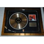 A commemorative gold disc Meatloaf, Bat out of Hell with COA, framed and glazed Condition Report: