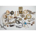 A collection of vintage costume jewellery to include cameos, Victorian items and a retro pendant