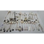 A lot comprising assorted silver spoons, forks, tongs and a toddy ladle, 758gms weighable