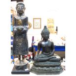 A cast metal Tibetan Buddha and a gilded wood figure Condition Report: Available upon request